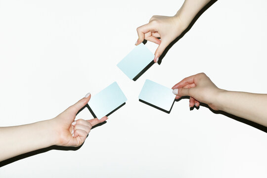 Hand holding many colourful finance money payment credit debit cards 