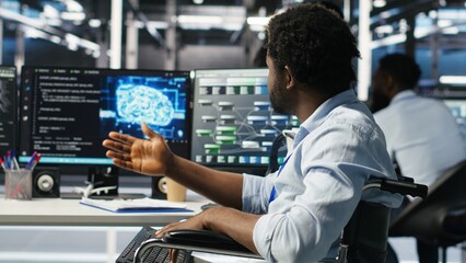 Man in wheelchair dissatisfied with server farm AI analytics metrics. Data center admin with paraplegia frustrated by glitches while automating tasks using node tree programming tool, camera B