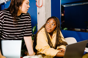 Medium view of professional woman evaluating the work of a freelancer