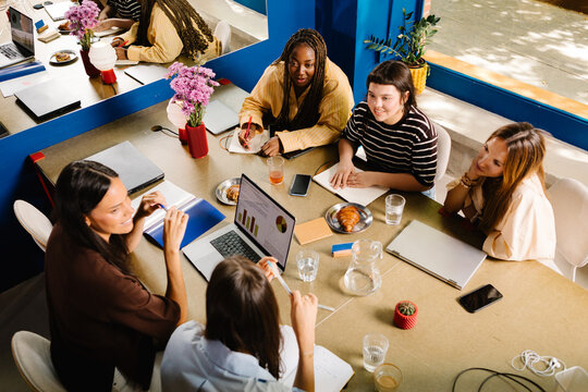 A team of executive women conducting a creative meeting
