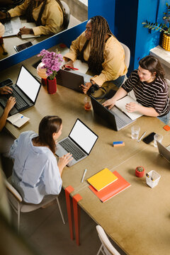 Meeting room in a modern office with a group of women in a reunion