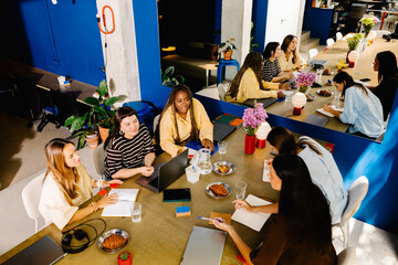 A collaborative environment with a group of women holding a meeting