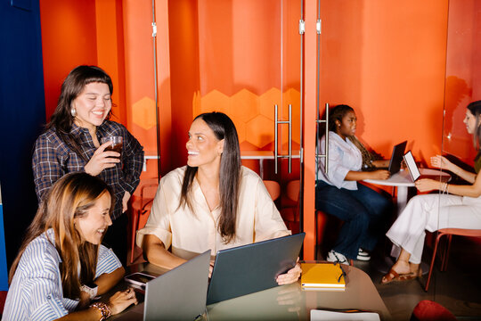 Different work teams in an office at a digital company