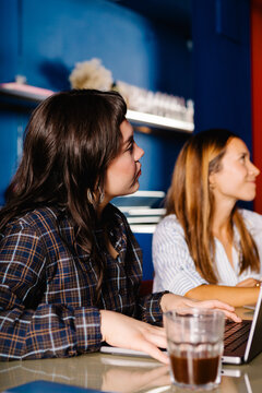 Female office workers paying attention during a presentation