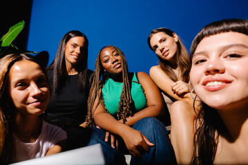 Ultra-wide perspective of women entrepreneurs modeling together