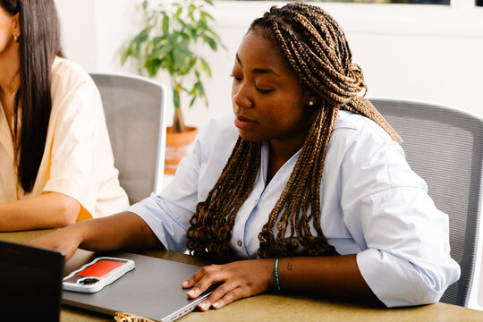 Black woman participating in a meeting of the board of directors