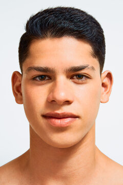 Front-facing portrait of young man with clean skin