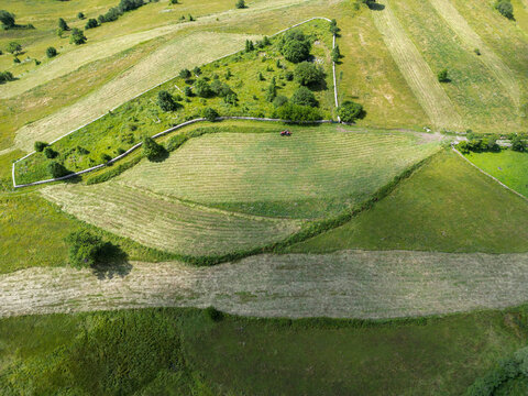 Aerial view of mowed meadow and farmland