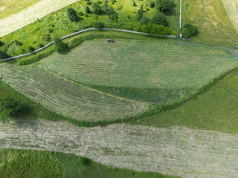Aerial view of mowed meadow and farmland