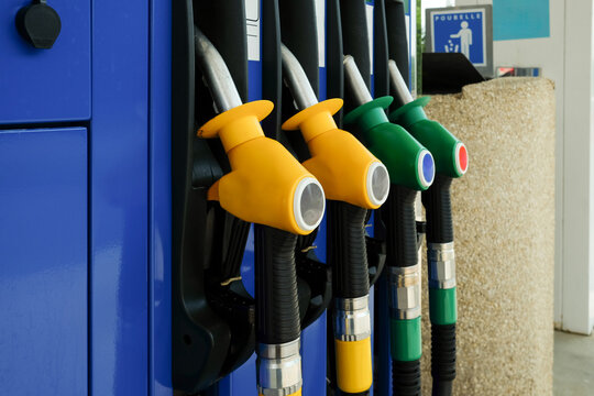 Colorful Fuel Nozzles at Gas Station