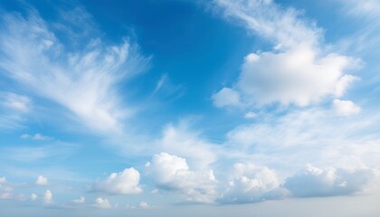 Obraz premium a soft pastel blue sky adorned with gentle wispy clouds drifting by