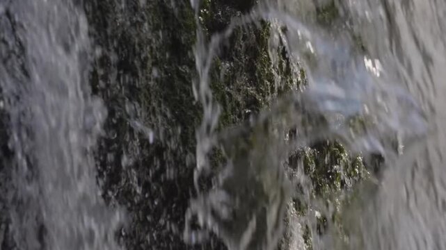Experience the majestic beauty of the Kuk Karauk Waterfall, nestled in the scenic South Ural mountains of Russia. This footage captures the powerful flow of fresh water cascading over moss-covered roc