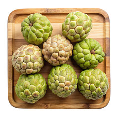 Fototapeta premium A top down view of nine ripe green custard apples arranged on a wooden tray isolated on transparent background