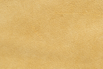 Smooth tan leather texture background for design, crafting, upholstery, and fashion applications showcasing natural material properties