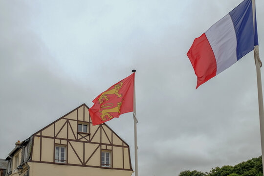 French and Normandy Flags Above Hotel