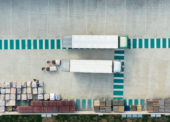 Aerial Workers Unloading Trucks Industrial Warehouse Docks