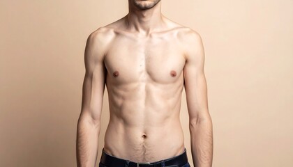 Bare-chested person with a thin build stands against a neutral backdrop