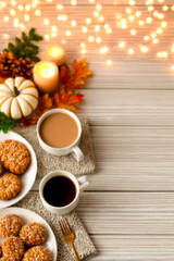 Fototapeta premium Warm autumn scene with coffee, cookies, candles and fall leaves on wooden background