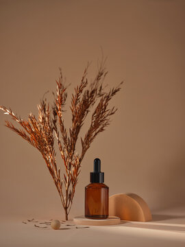 Serum bottle with decorative elements creating an inviting composition