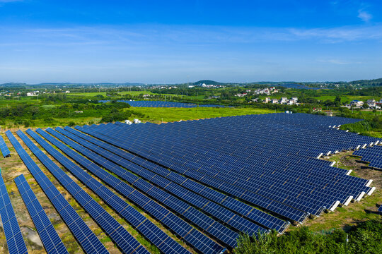 Large-scale solar power plant in green countryside
