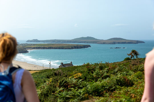 Anonymous female hikers appreciating a view.