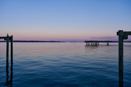 unset Over Pier and Calm Sea in Sidney on Vancouver Island