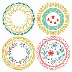 Vector art of set of four circular decorative elements with floral and geometric patterns