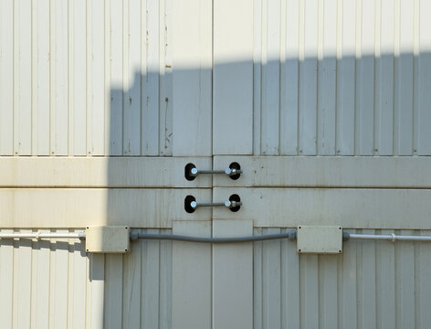 Close-Up of Industrial Bolts and Cables on a Metal Structure