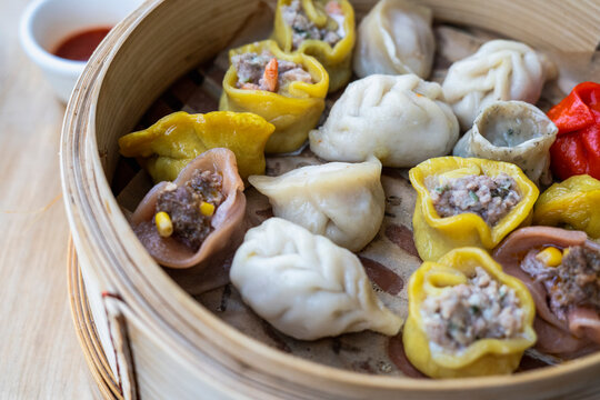 Colorful dumplings in a steamer 