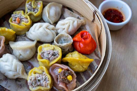 Colorful dumplings in a steamer 