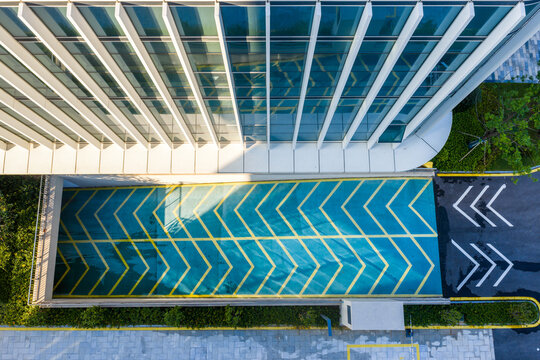 Aerial view of modern building with parking entrance