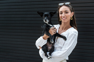 Loving female sharing tender connection with her adopted dog