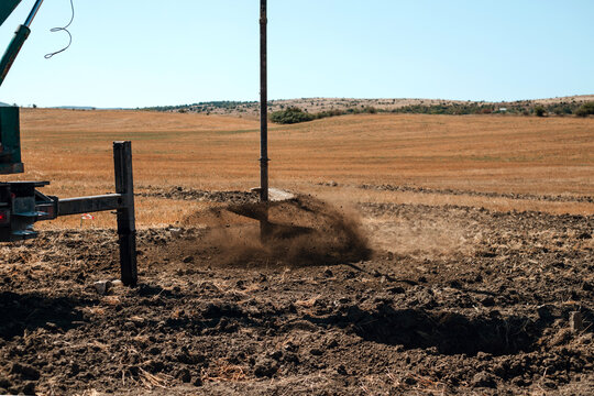 A drilling rig is drilling the ground to construct a water well.