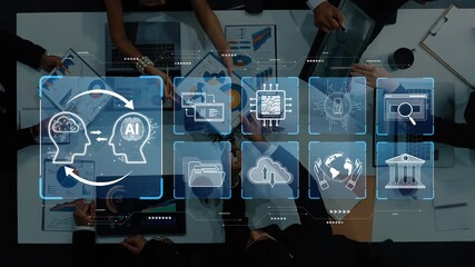 A dynamic business meeting showcasing professionals engaging with AI technology and data analysis tools, emphasizing collaboration and strategic planning in a modern workspace. Raster - Powered by Adobe