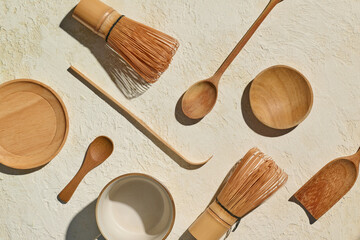 Flat Lay of matcha Tea Ceremony Utensils  on Rustic Textured Surface