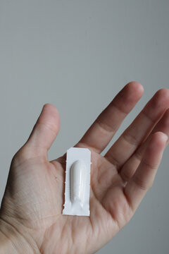 Female holding Progesterone Suppository