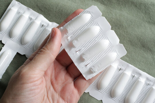 Female holding Progesterone Suppository