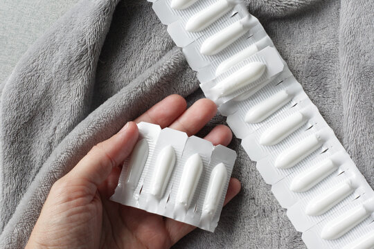 Female holding Progesterone Suppository