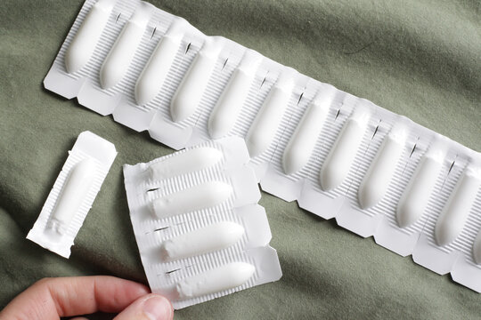 Female holding Progesterone Suppository