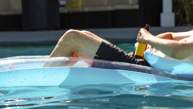 Man Drinking in the Pool