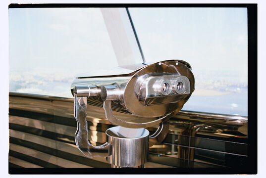 A glittering telescope on the observation deck.