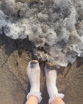 Odd Unusual Person with Wet Socks at Beach