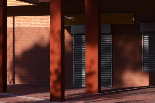 Red columns in the arcades of an apartment building