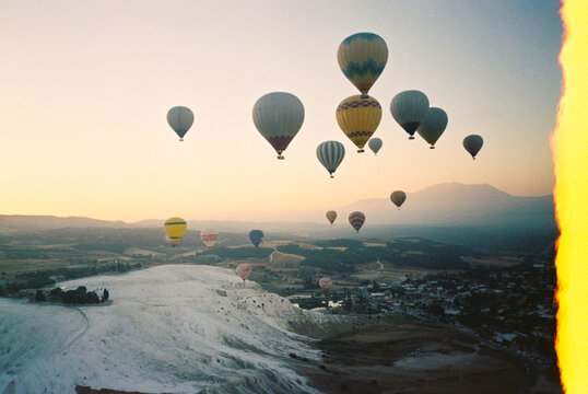 Hot air balloons flying at sunrise landscape
