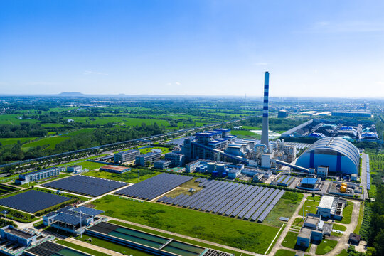 Thermal power plant with solar panels in front