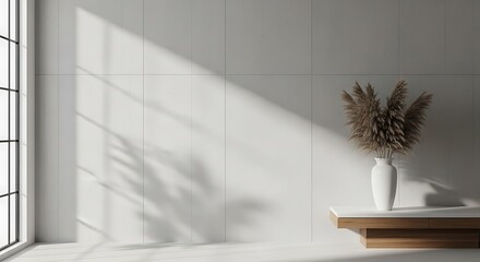 Serene sunlit interior with pampas grass in a white vase against a minimalist backdrop creating a tranquil ambiance