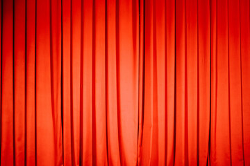 Elegant red stage curtain covering a performance venue