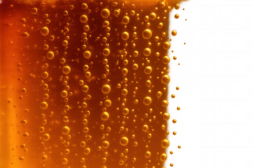 Golden beer bubbles rising in carbonated liquid with transparent background, refreshing beverage texture