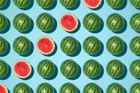 A colorful, repeating pattern features whole and sliced