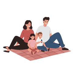 Fototapeta premium Happy family of four sitting together on a picnic blanket.